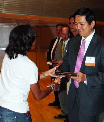When alumni present copies of The Iliad to incoming students, as Tao Tan ’07, ’11 Business did here in Lerner Hall, it represents a passing of the torch and an affirmation of the rich tradition of the Core Curriculum.